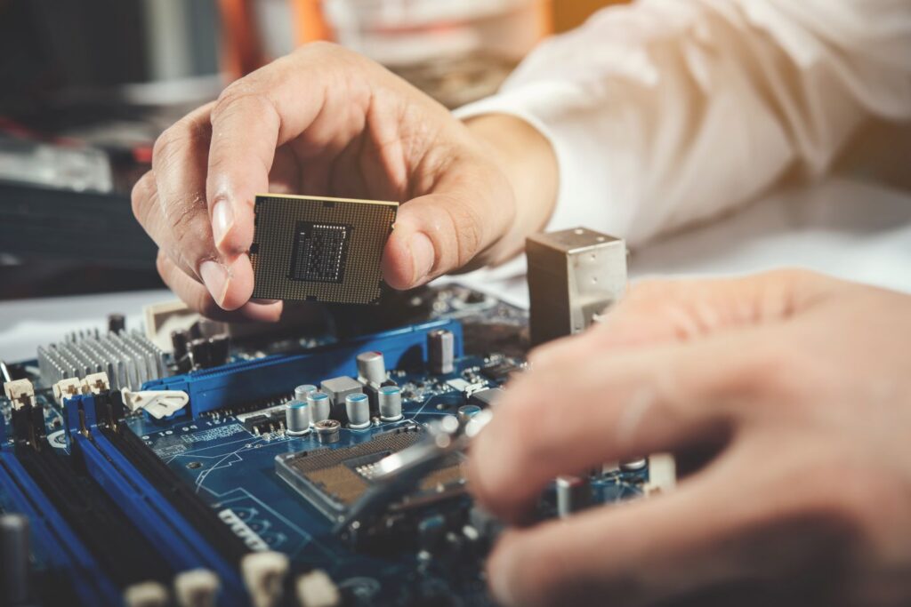 technician repairing computer